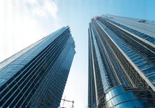 Skyscrapers under construction representing property development