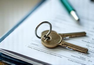 Keys on a clipboard representing property management services