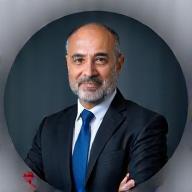 Professional headshot of Khalid Hassan